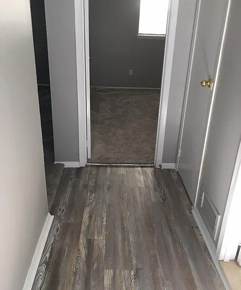 Hallway-
kitchen on left , living room second left, bathroom on right, bedroom straight ahead