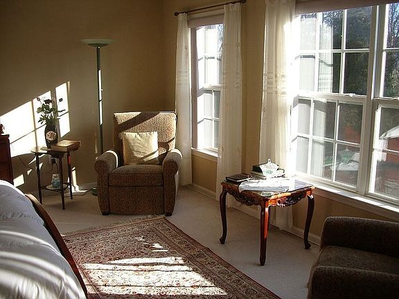 Sunny Master Bedroom overlooking Trees and Spacious Backyard