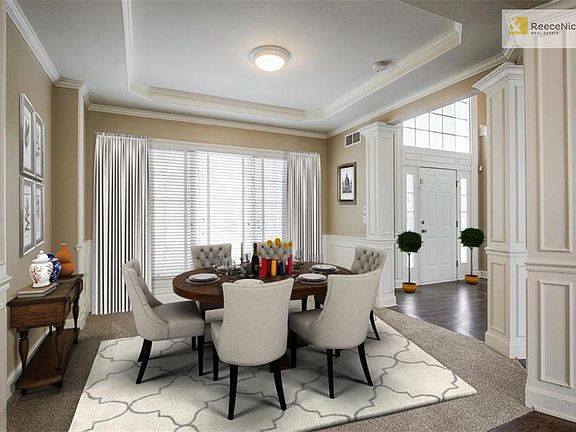 Formal Dining Room with wall of windows. (This room has been virtually staged.)