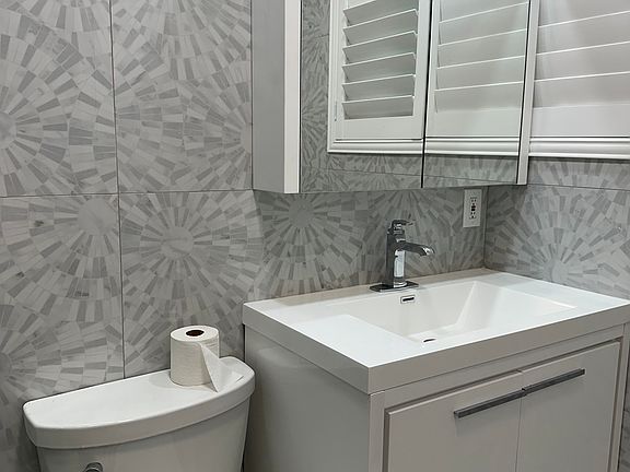 New bathroom- mirror-vanity-toilet