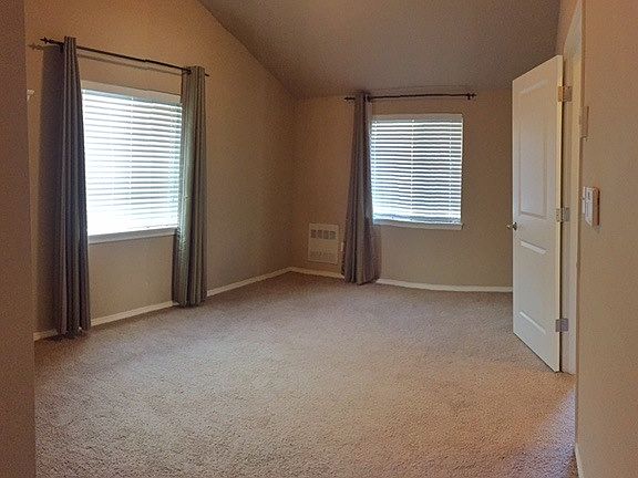 Spacious master bedroom with vaulted ceiling