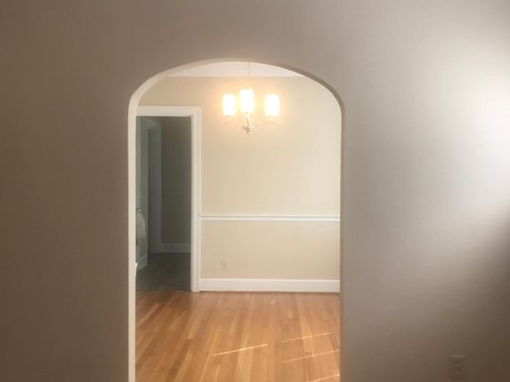 Living Room to dining room to kitchen three windows in living room, two windows in dining room, two kitchen windows