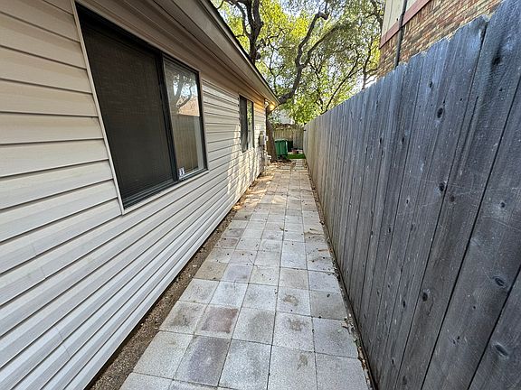 Newly installed step stones with red crush granite to add some color and safety. Step Stones make it easy to walk to the backyard. New gutters will just keep it dry and nicely in place.