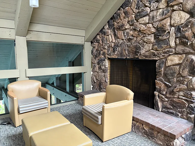 A cozy fireplace area on the 2nd floor of the clubhouse encompasses a tranquil, distraction-free area to get work done