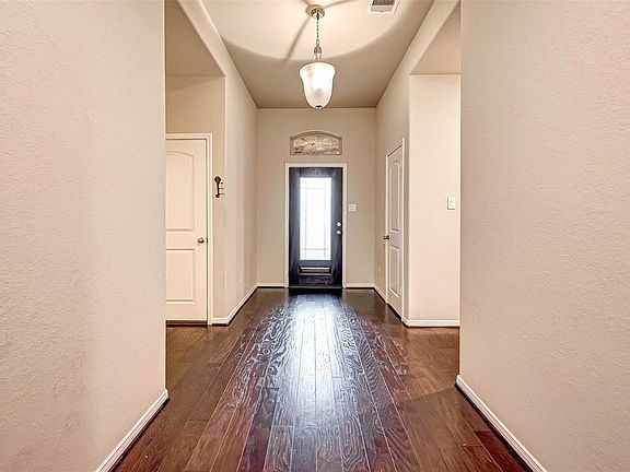 The first thing you'll notice upon entry is the warm wood flooring from front to back throughout all living areas!