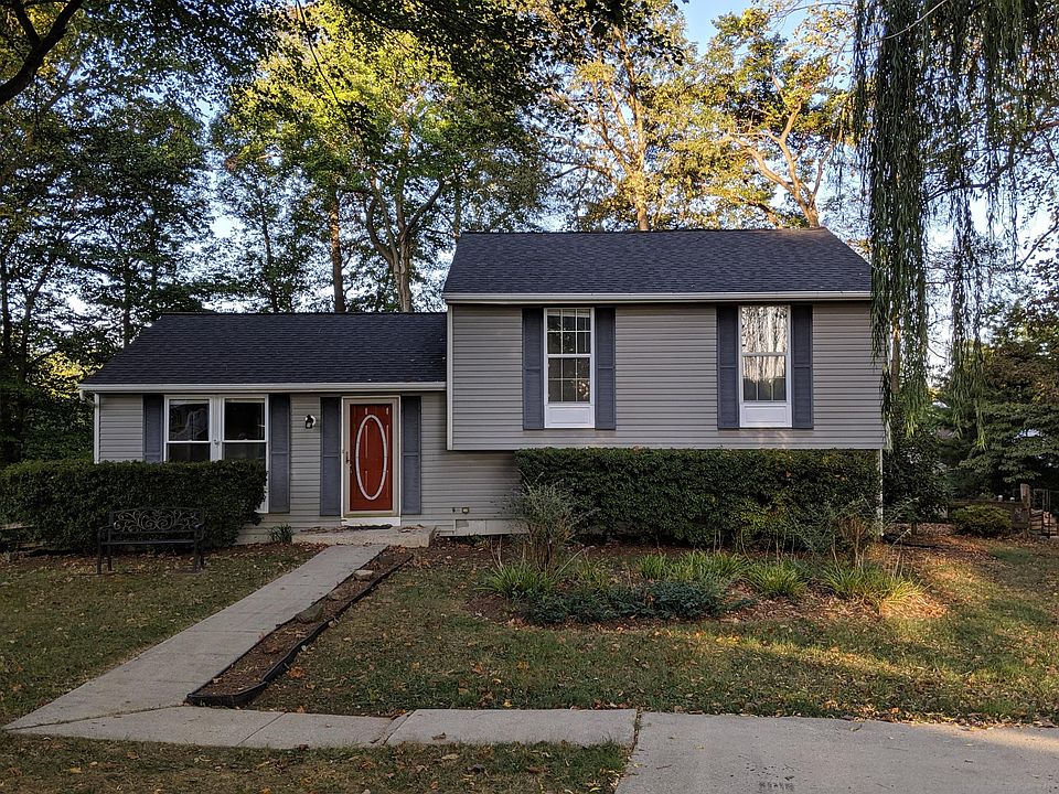 Exterior front; off-street parking; treed yard; landscaping
