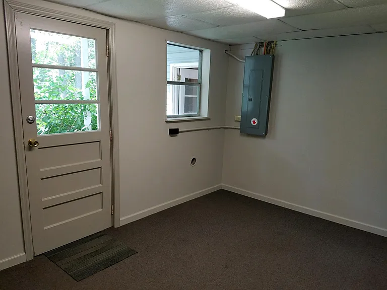 Laundry room with access to back porch and yard.