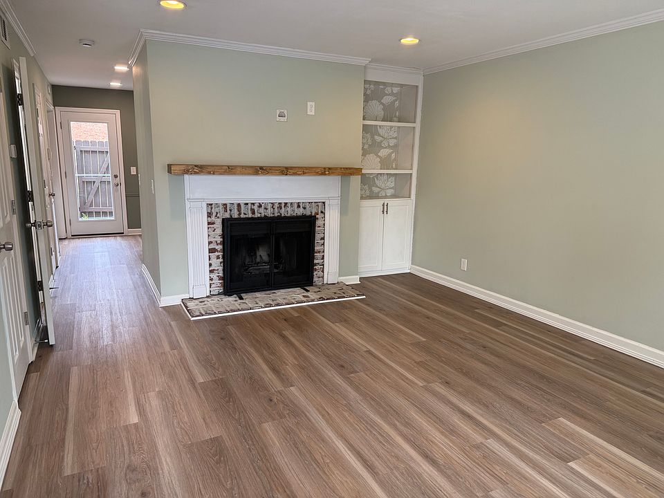 living room with can lighting and view to back patio