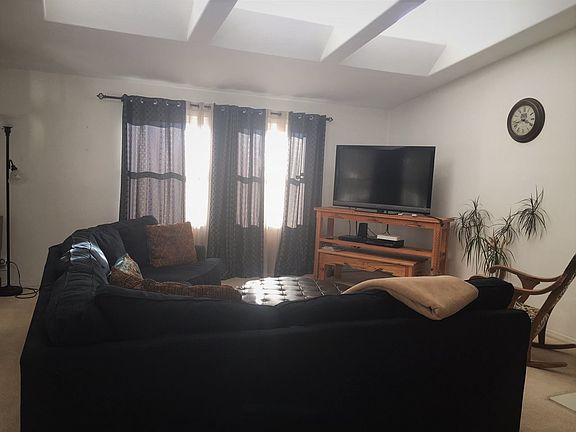 Ample space with beautiful Clear Story Windows and large fireplace both to warm the heart of this home.