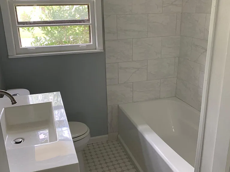 Hall bath with tub and shower
