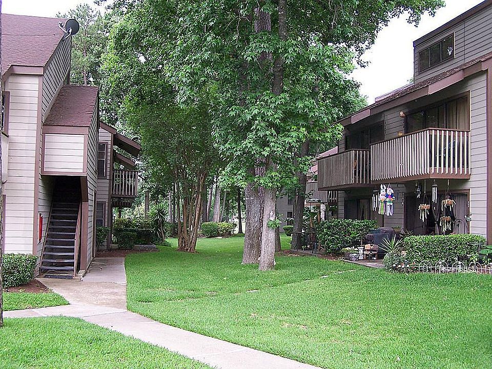 Complex has well maintained courtyard with lush greenery.