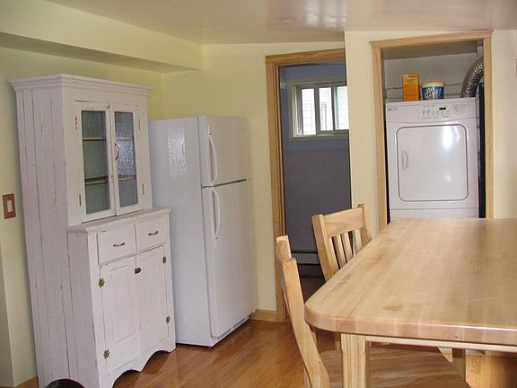kitchen looking toward bathroom and washer/ dryer