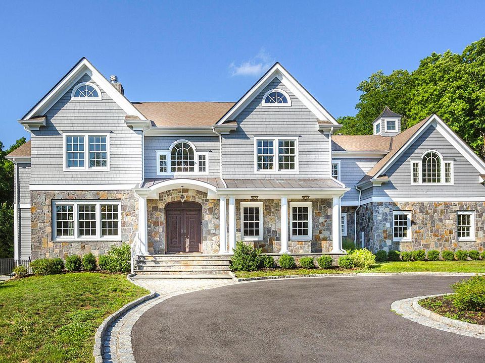 Enjoy Living in this Stunning 6 Bedroom Home in a Park-like Setting in Greenwich, CT!