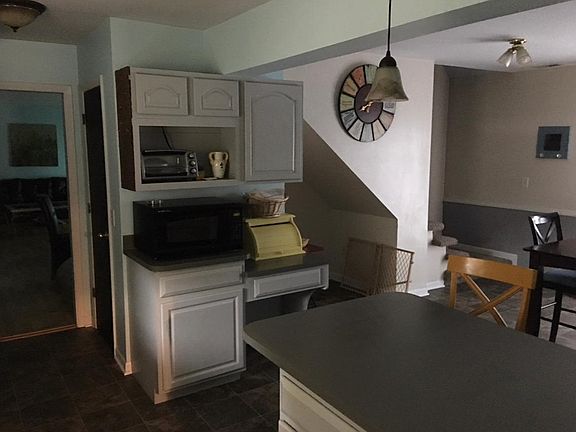Large eat-in kitchen with fireplace.