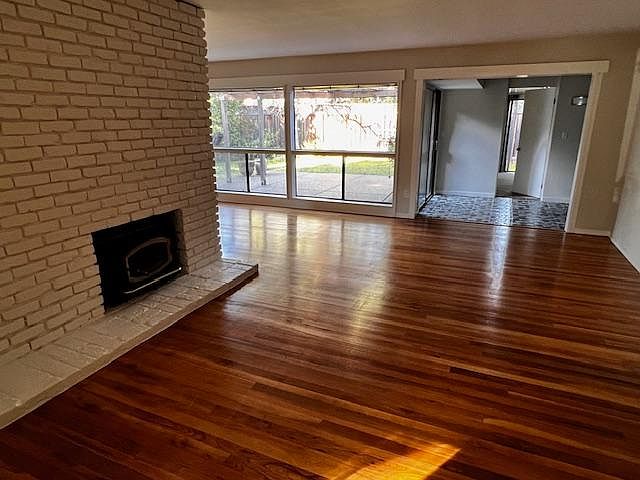 Living room, dining area, working fireplace with stove insert