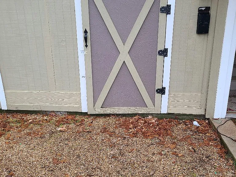 Storage unit with door closed. Entrance to apartment to the right.