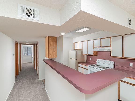 Kitchen with Breakfast Bar and Hallway
