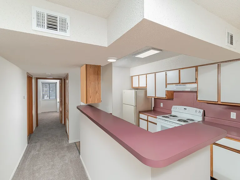 Kitchen with Breakfast Bar and Hallway