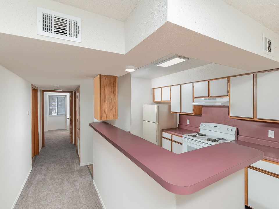 Kitchen with Breakfast Bar and Hallway