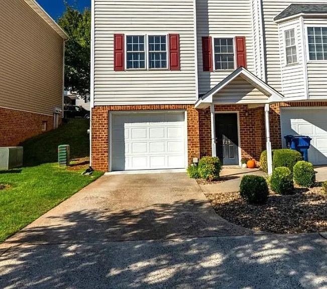 Front view; garage and driveway to terrace entrance