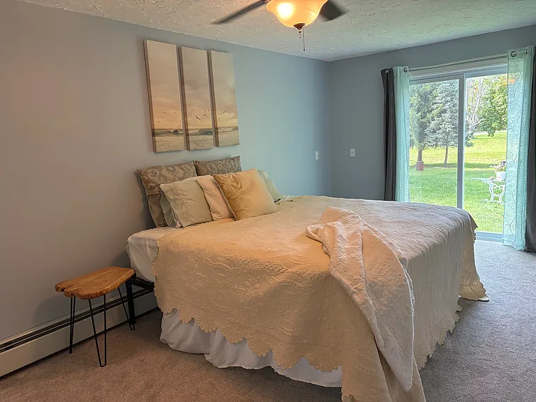En Suite Bedroom #1 - King Bed with sliding doors out to back yard and fire area