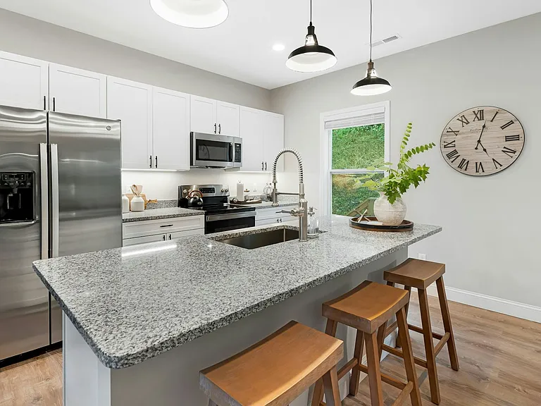 Freshly installed granite countertops and premium lighting
