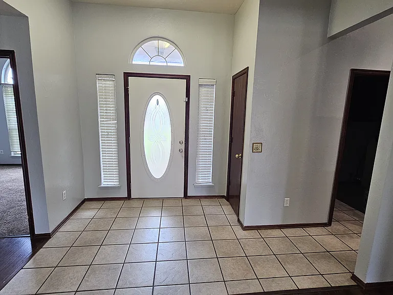 Foyer with coat closet on right