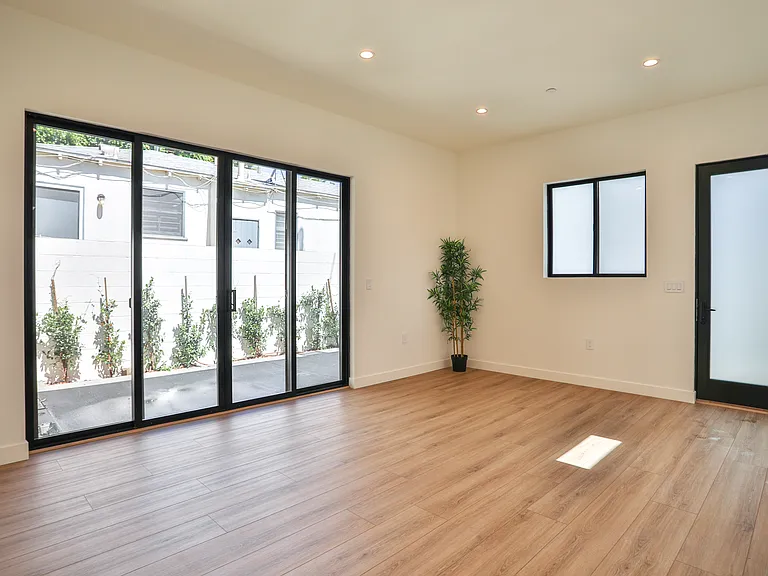 Living room connects to private patio
