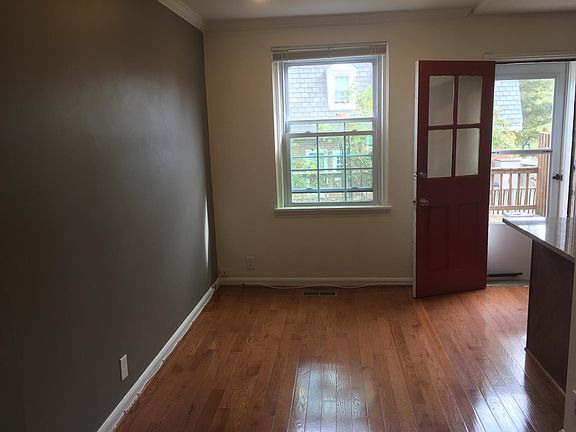 dining room, back door to deck, kitchen counter, counter bar seating at granite countertop