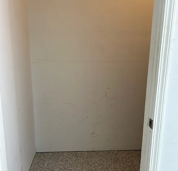 Storage closet off garage is 3'6" X 7'6" with shelving