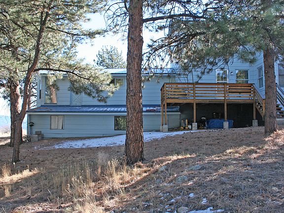 Back of home with deck