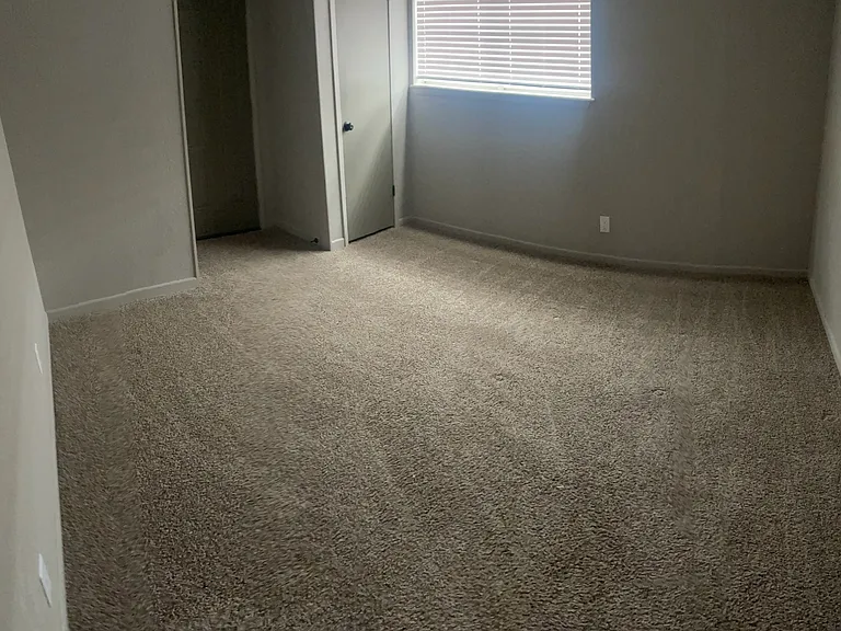 Bedroom 2 -
Center - Laundry Room door
Right - Walk in closet