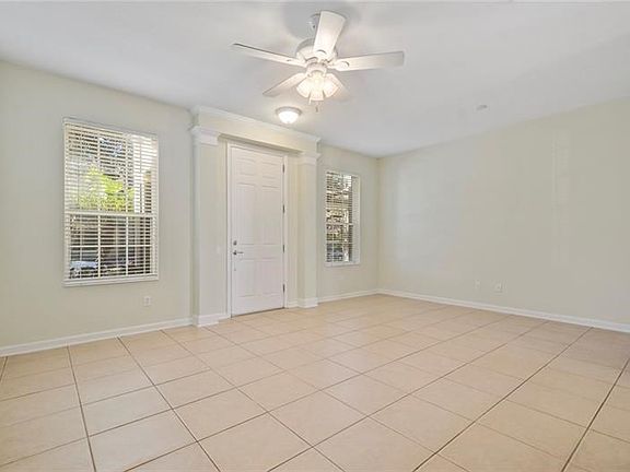 Light and bright living area room access through front door.