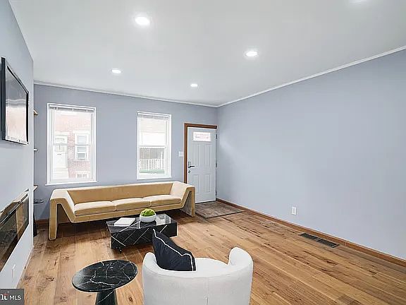 Tons of natural light comes through the living room windows.