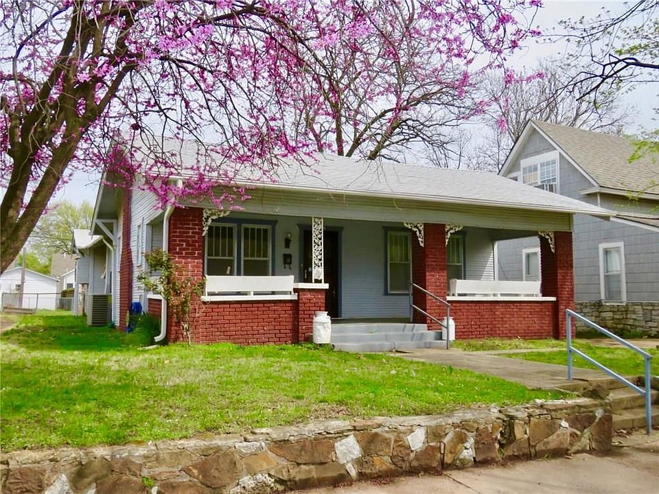 Front of the home.  Ready to plant your spring flowers in the built-in planters.
