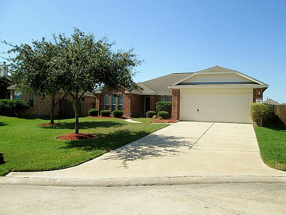 Notice the mature, professional landscaping. Nice parking pad for guests.