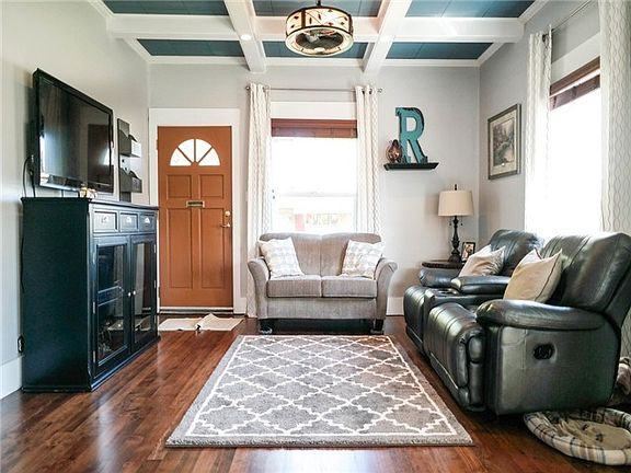 Living room and front entry.