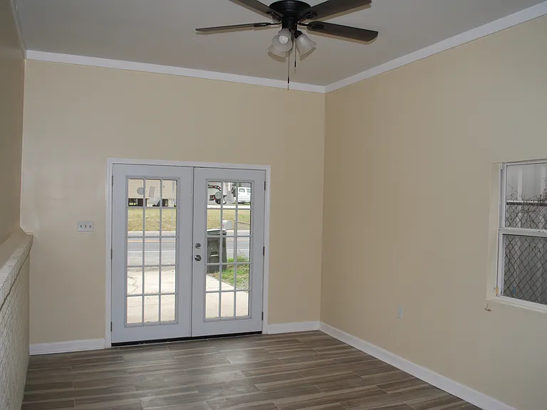 Master Bedroom, formerly carport. French doors exit to Main street.