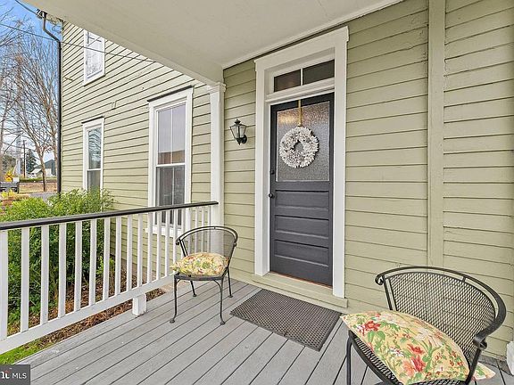 Sizable side porch with access into the living room.
