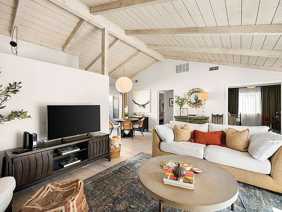 Main living area. TVs feature 230+ cable channels and Netflix. Other apps can be downloaded for guest log in.