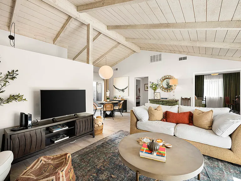Main living area. TVs feature 230+ cable channels and Netflix. Other apps can be downloaded for guest log in.