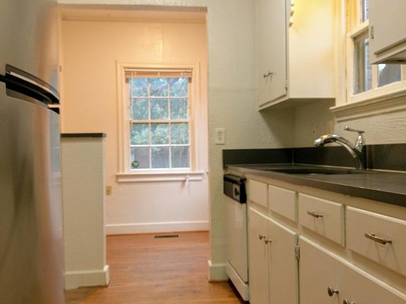 A view through the galley kitchen to the breakfast room.