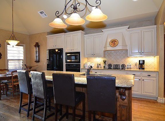 Kitchen includes large breakfast bar 
