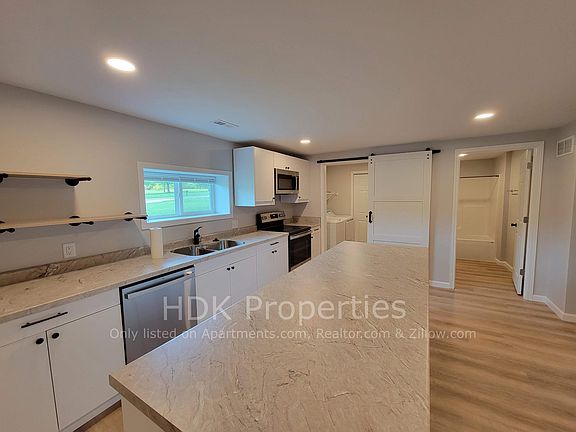 Kitchen facing laundry room and main bathroom