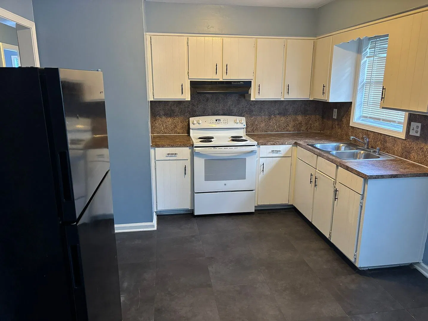 Cozy & Convenient Living with Eat-In Kitchen, Storage & Covered Parking! — Photo 4
