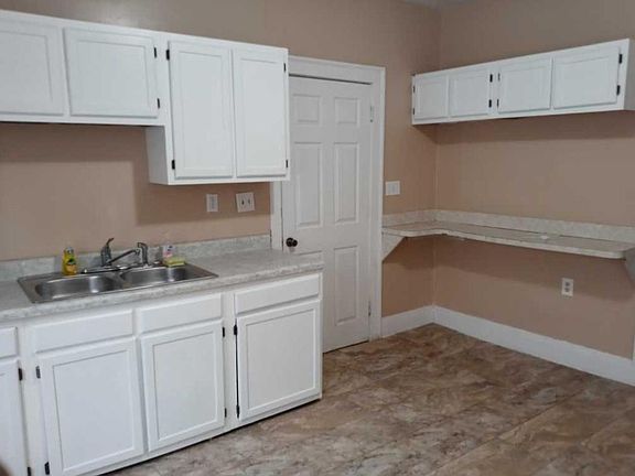 Eat in kitchen. Plenty cabinet space.. Painted,breakfast bar new laminate flooring.