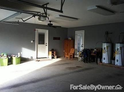2 car garage; door with window goes into house
door on right goes to patio
