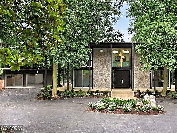 Frank Lloyd Wright influence on this modern home with ample 