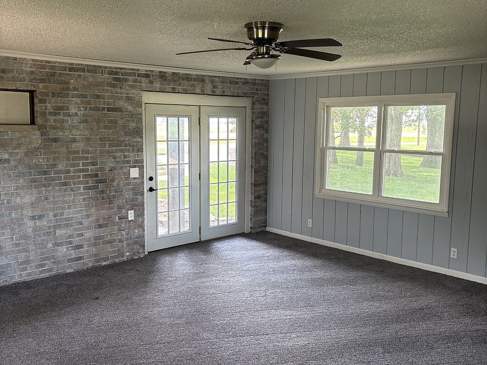 Livingroom space 1 with natural light and doors that lead outside!
