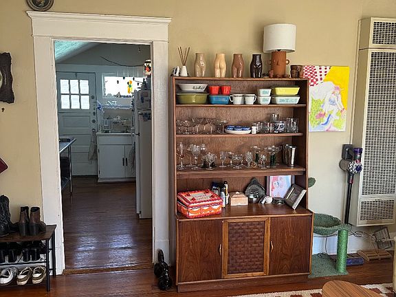 Living room leads to efficient kitchen